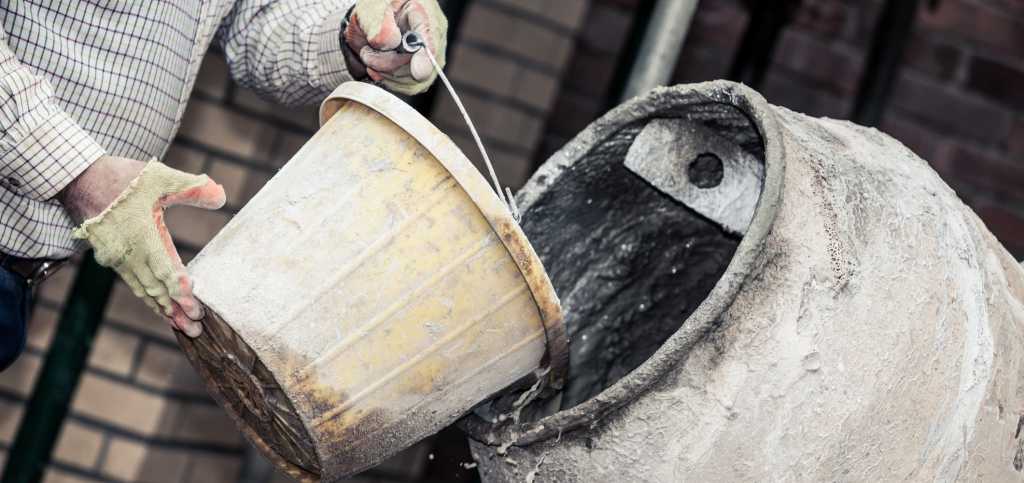 Concrete mix being poured into cement mixer | EasyMix Concrete